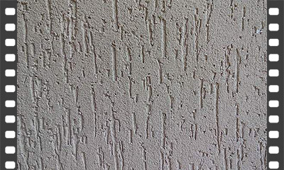 Aplicação de textura tipo grafiato sobre parede com emboço